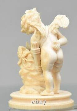 Antique Carved Figurine of Cupid with heart and arrows. Let this be your Angel