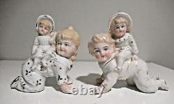 Antique Gebruder Heubach porcelain crawling piano babies pair w riders Germany