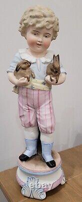 Antique German Bisque Boy Figurine Holding Two Bunny Rabbit Heubach