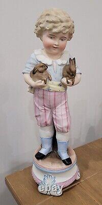 Antique German Bisque Boy Figurine Holding Two Bunny Rabbit Heubach