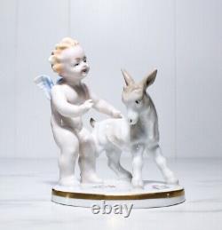 Antique Hand Painted Germany Hallmarked Cherub with Donkey Porcelain Figurine