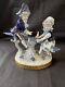 Antique German Volkstedt Porcelain Figurine Boy And Girl Playing. Marked