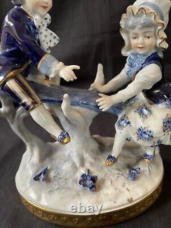 Antique german volkstedt porcelain figurine boy and girl playing. Marked