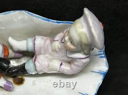 Conta & Boehme German Porcelain Figurine-Pulling Off Boot Of Friend/Shell Dish