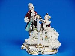Dresden Lace German Porcelain Musical Figurine. Measures H 5.5 L 5.5 W 4.5