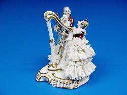 Dresden Lace German Porcelain Musical Figurine. Measures H 5.5 L 5.5 W 4.5