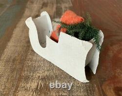 Vintage Clay Faced Santa Figure in Cardboard Sleigh Carrying A Christmas Tree