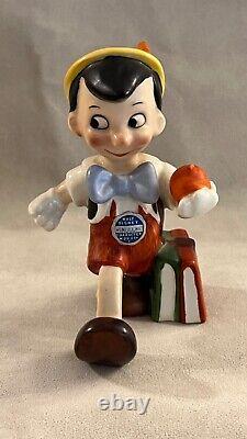 Vintage Disney Character figurine, Pinocchio walking with apple, Goebel Germany