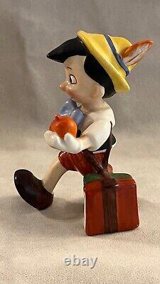 Vintage Disney Character figurine, Pinocchio walking with apple, Goebel Germany