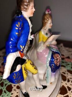Vintage Sitzendorf porcelain figurines. Seated reading woman withcourtly man