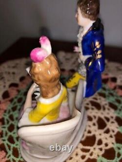 Vintage Sitzendorf porcelain figurines. Seated reading woman withcourtly man